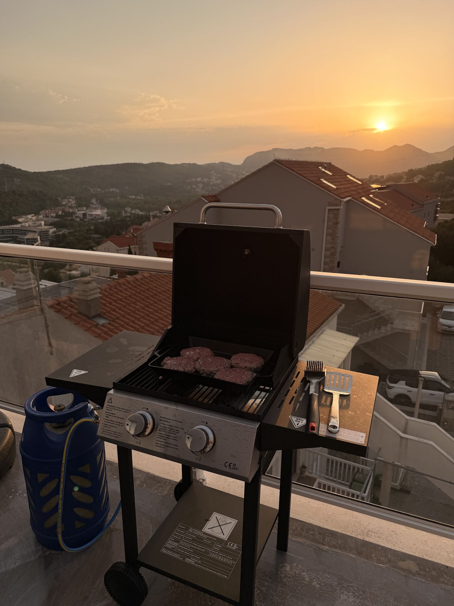 Terrace barbecue at sunset overlooking the hills
